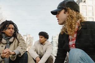 a group of young men sitting next to each other