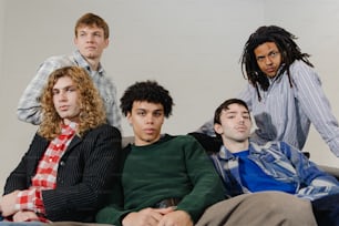 a group of young men sitting next to each other