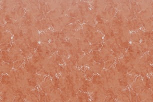 un fond de marbre orange avec des taches blanches