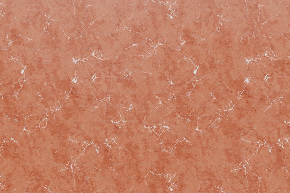 an orange marble background with white speckles