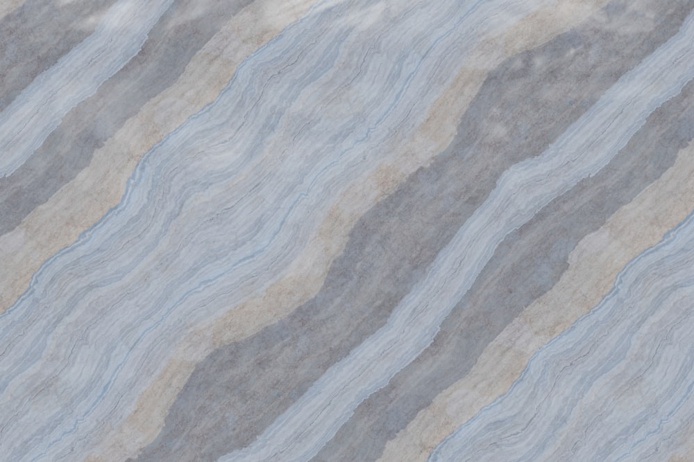 ein blauer und grauer strukturierter Marmorhintergrund