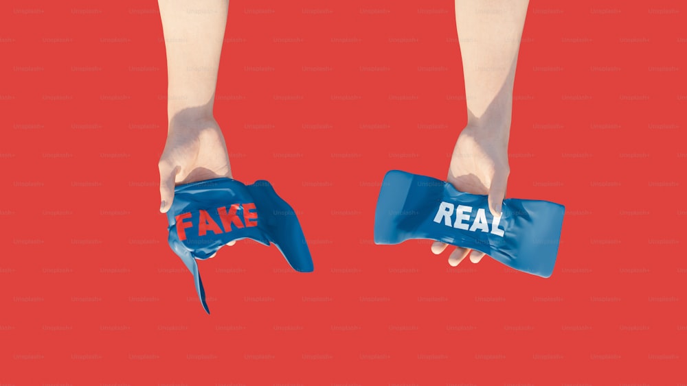 a pair of hands holding fake items with fake words on them