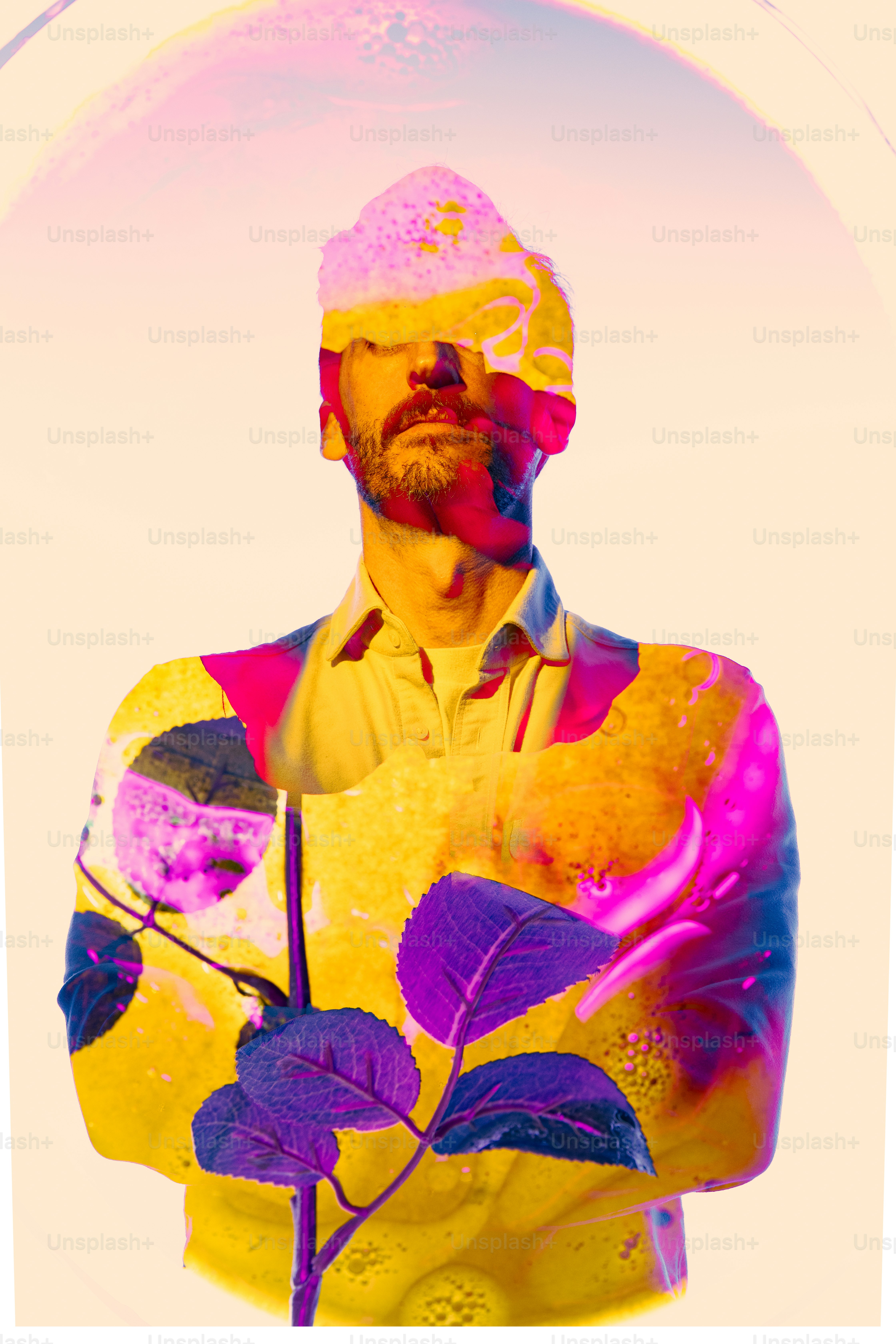 a man in a yellow shirt is holding a plant