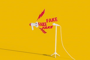 a yellow background with two microphones and a fake fake fake fake sign