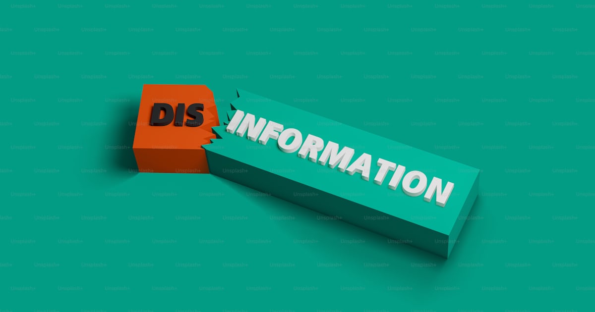 A piece of paper with the word dis information on it photo – Media ...