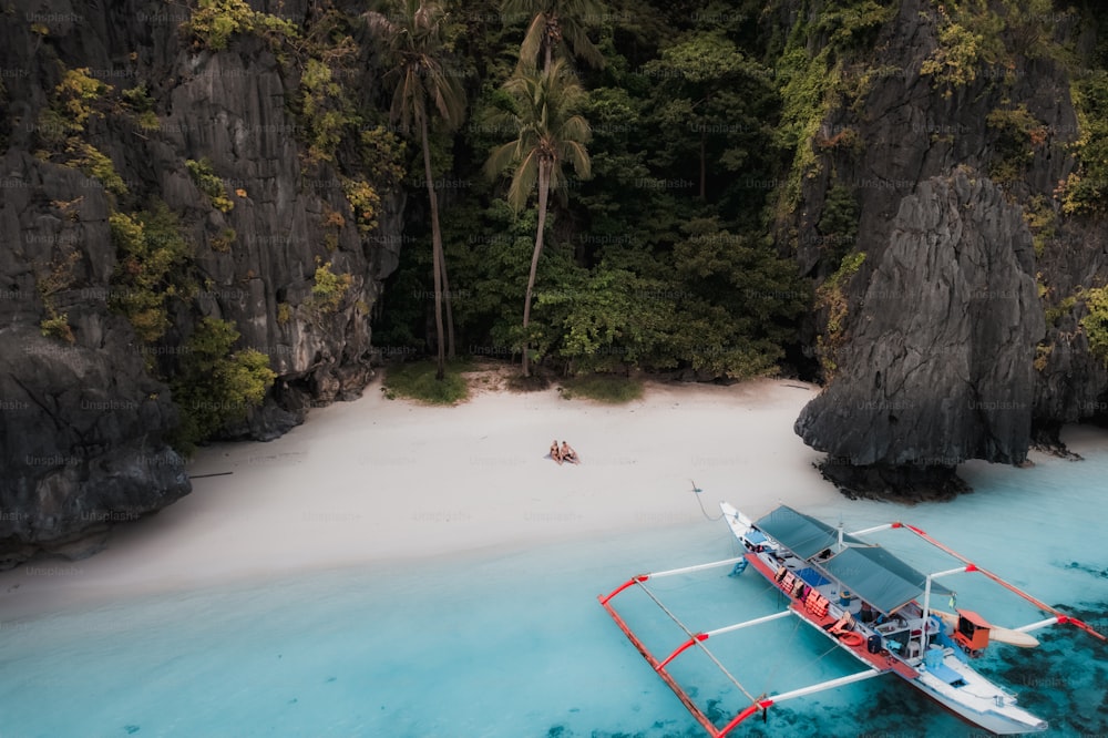 a boat on the water near a beach