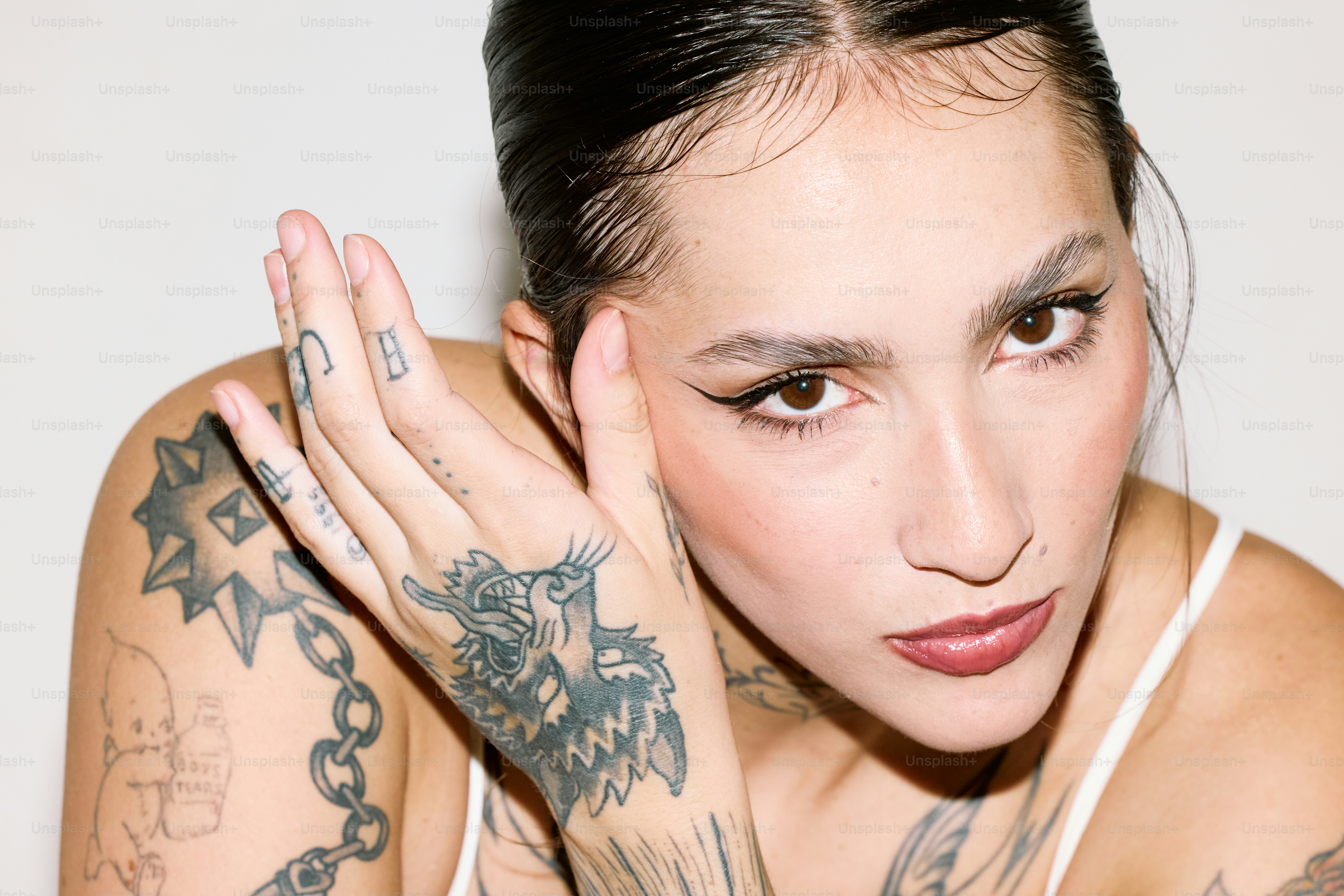 a woman with tattoos on her arm and arm