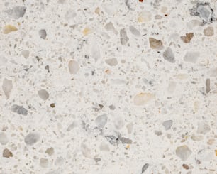 un gros plan d’une surface en marbre avec de petits rochers