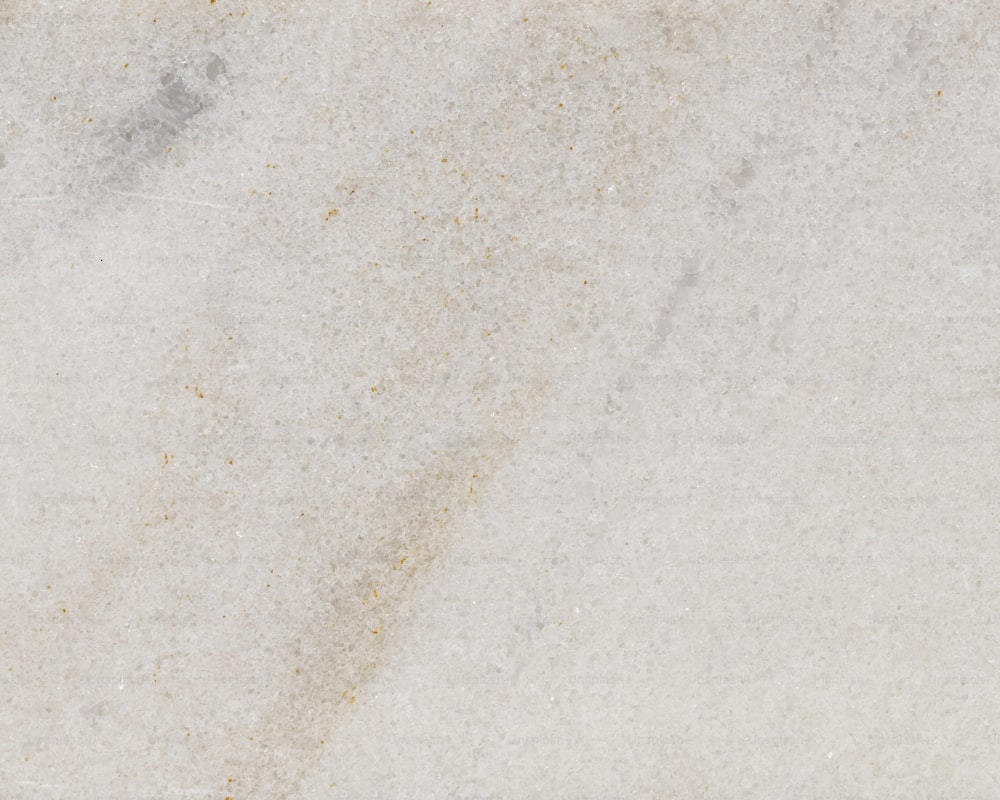 a close up of a white marble surface