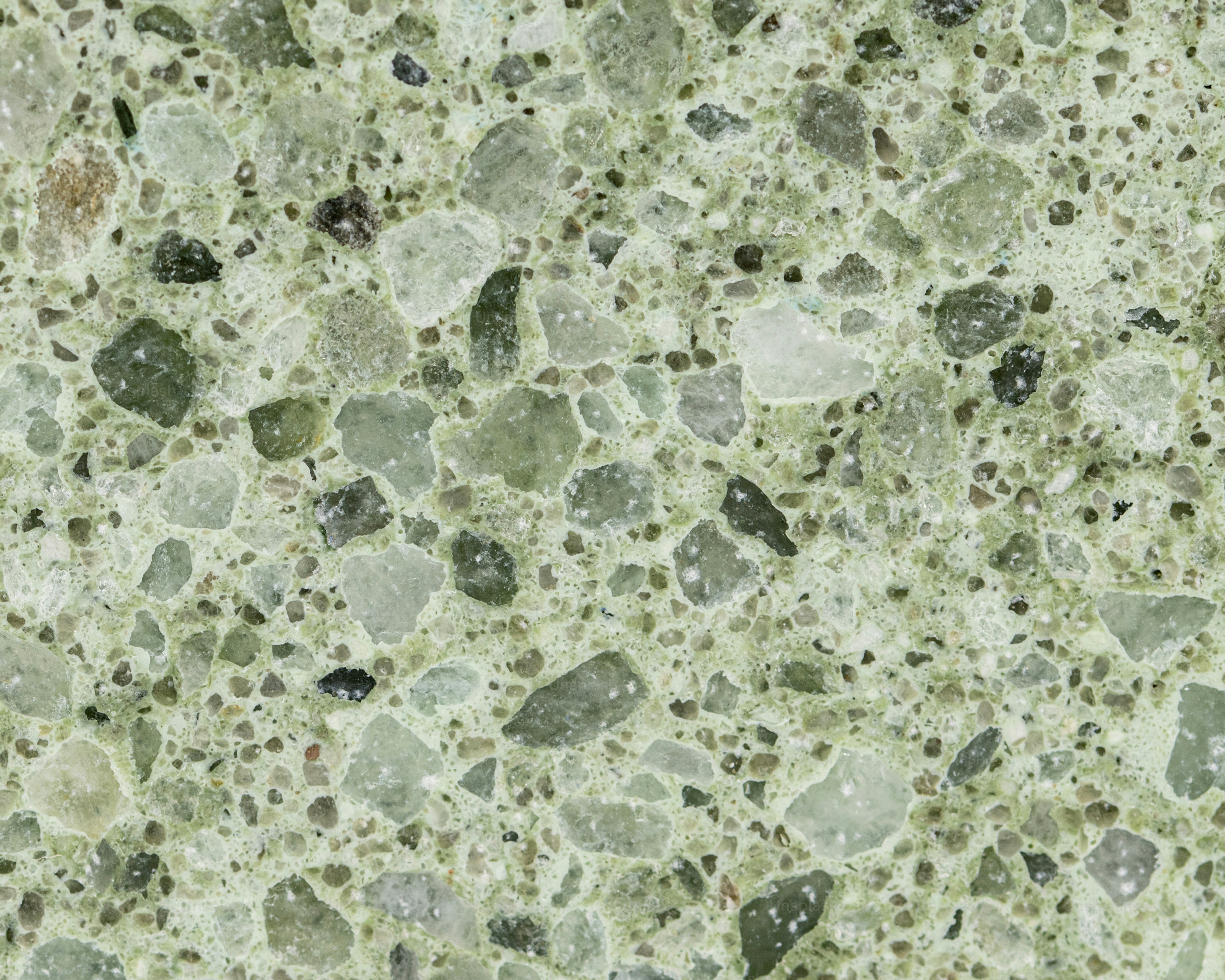 a close up of a green marble surface
