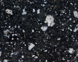 a close up of a black and white surface
