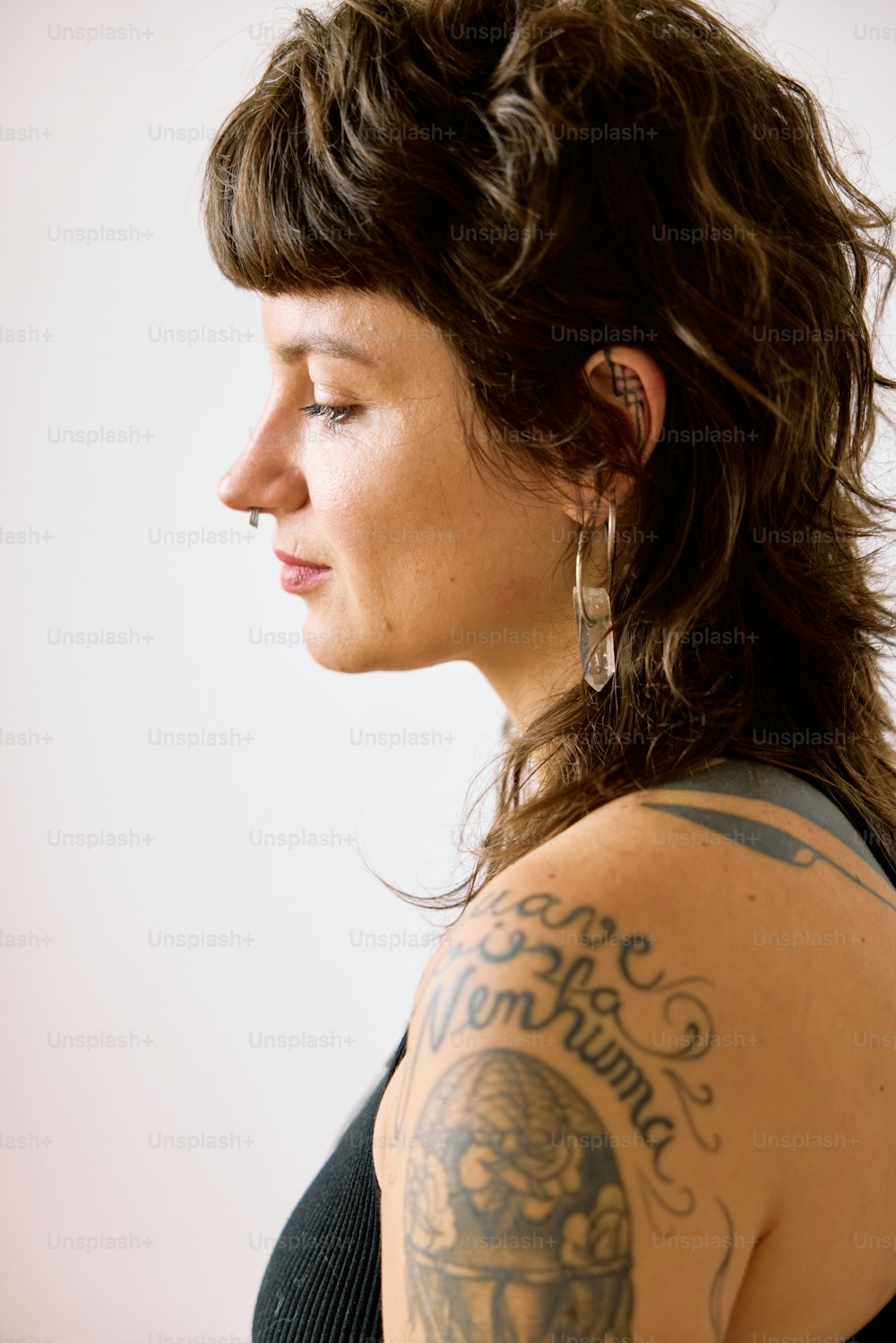 a woman with a tattoo on her arm