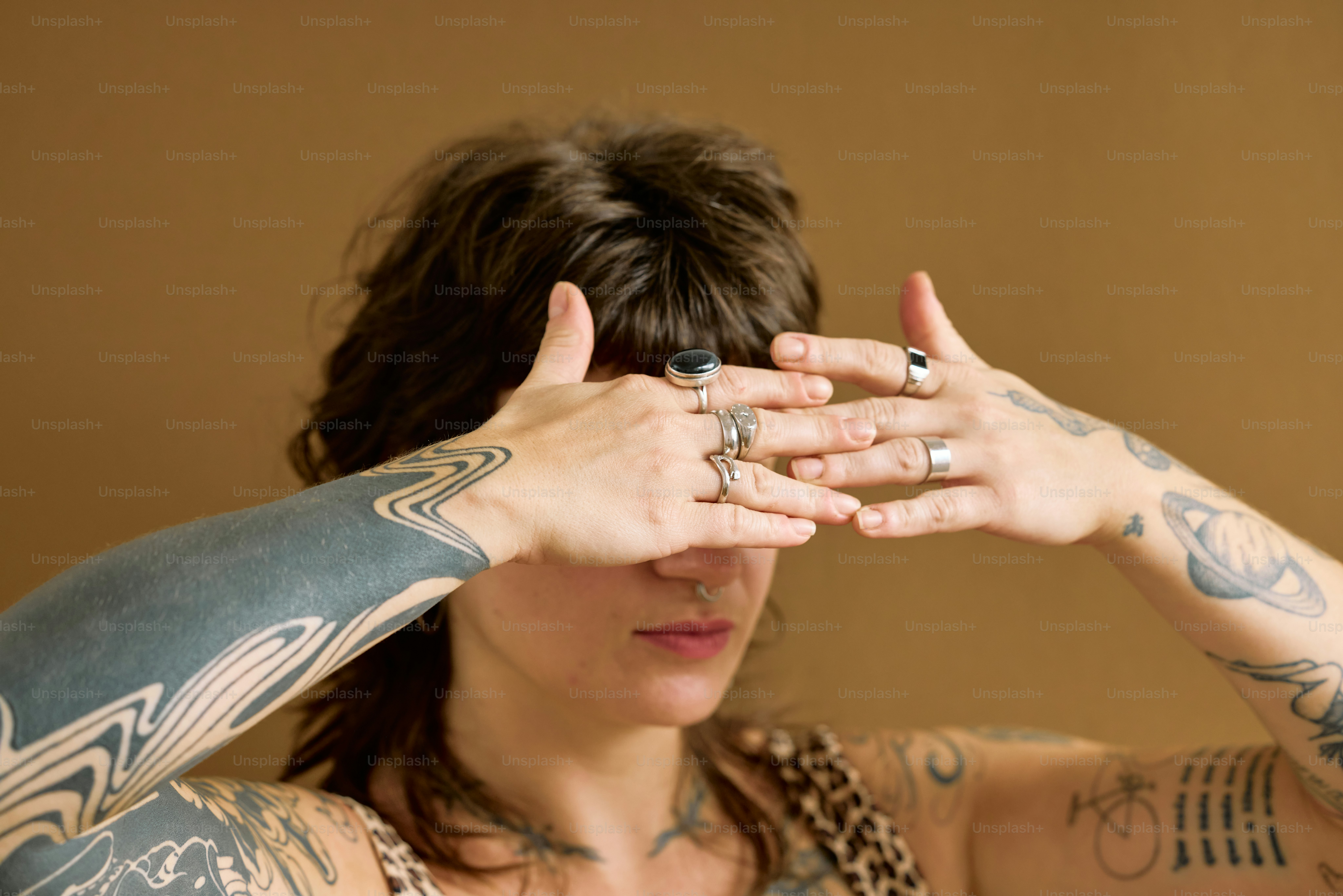 a woman covering her eyes with her hands