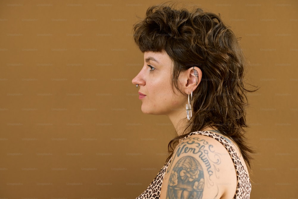 a woman with a tattoo on her arm
