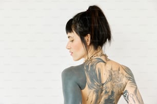 a woman with a lot of tattoos on her back