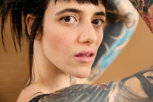a close up of a person with tattoos on their arms
