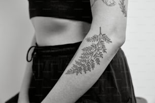 a woman with a tattoo on her arm