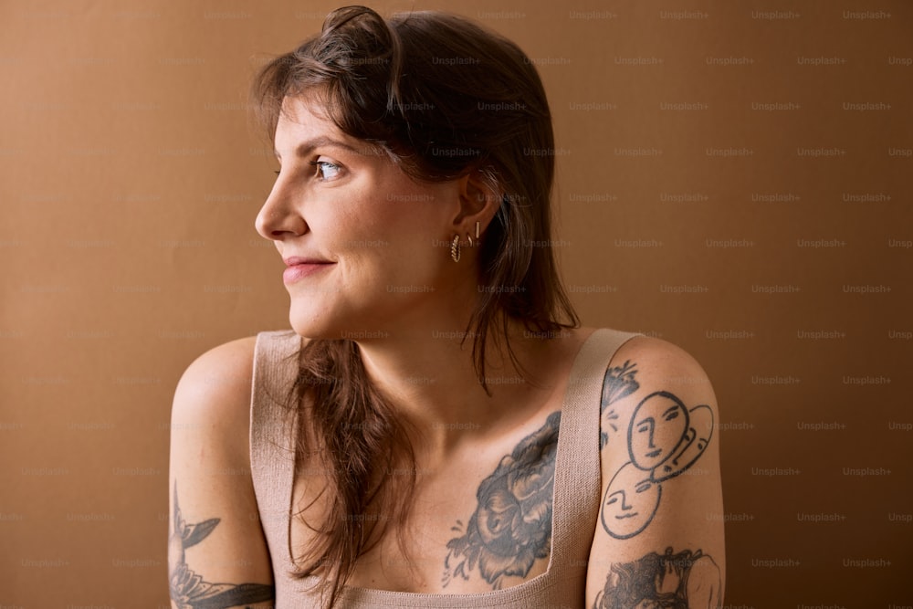 a woman with a tattoo on her arm