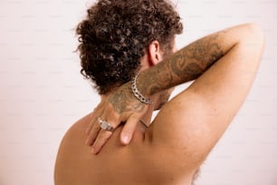 a man with a tattoo on his back