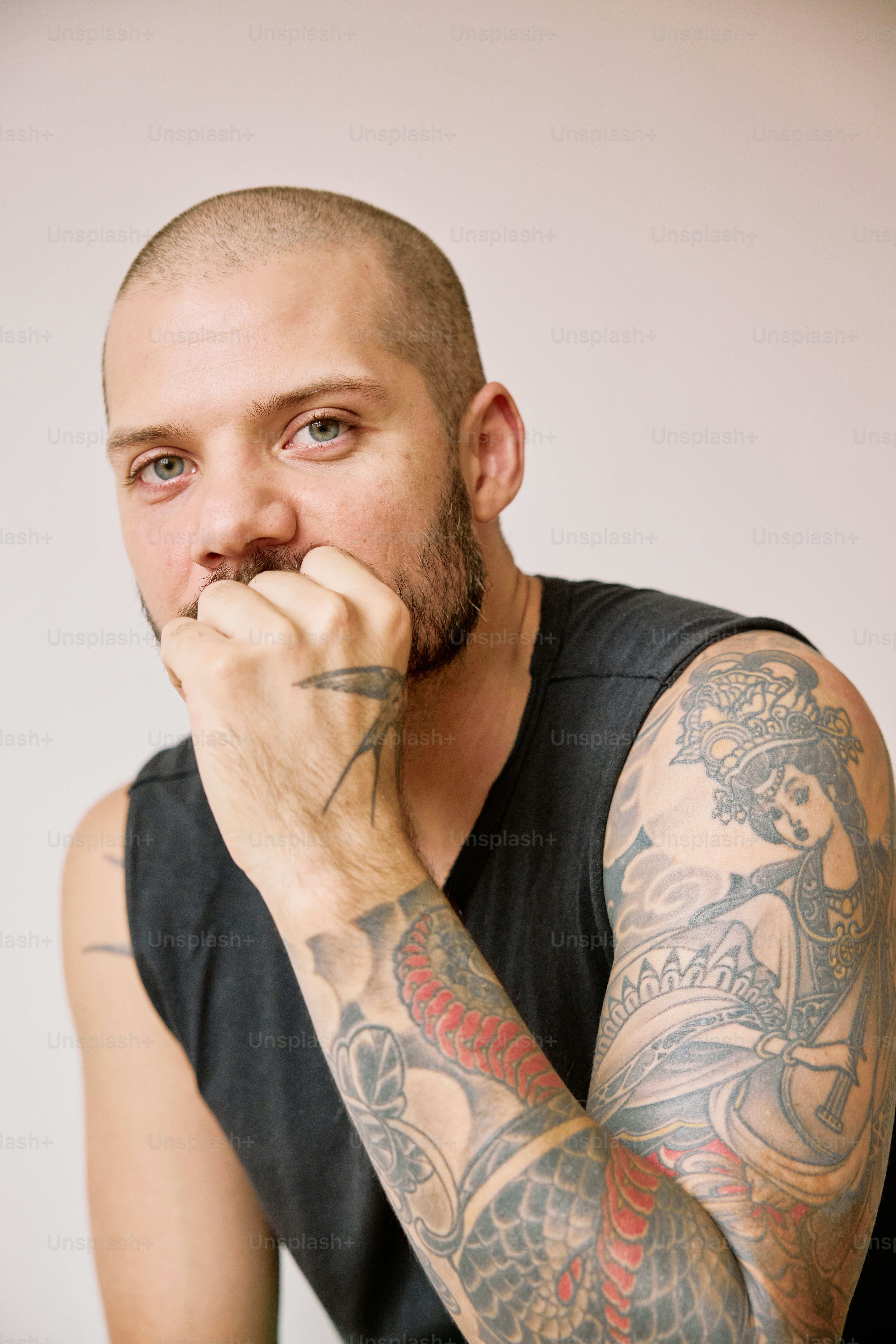 a man with a tattoo on his arm