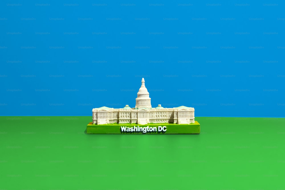 a model of the white house on a green surface