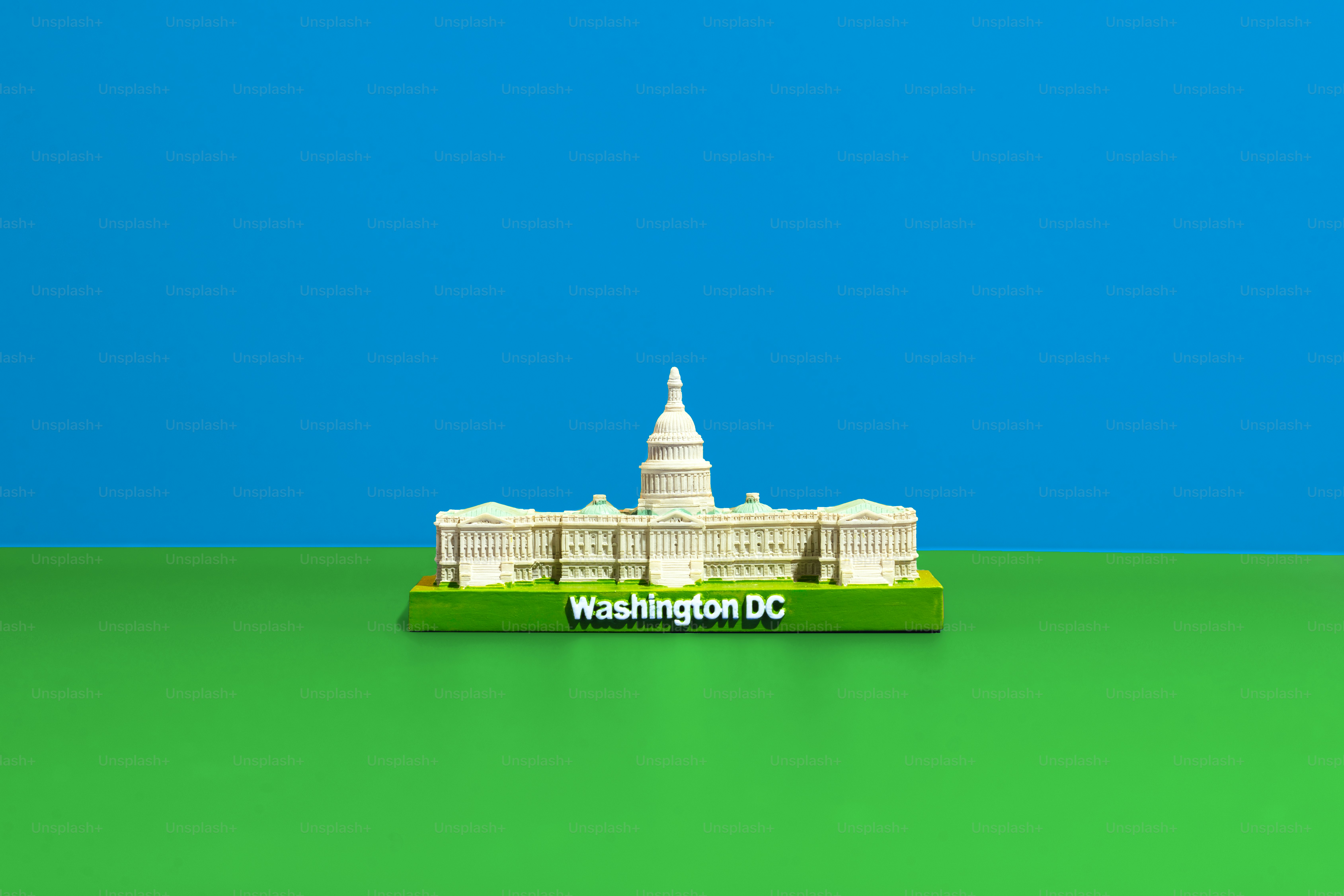 a model of the white house on a green surface