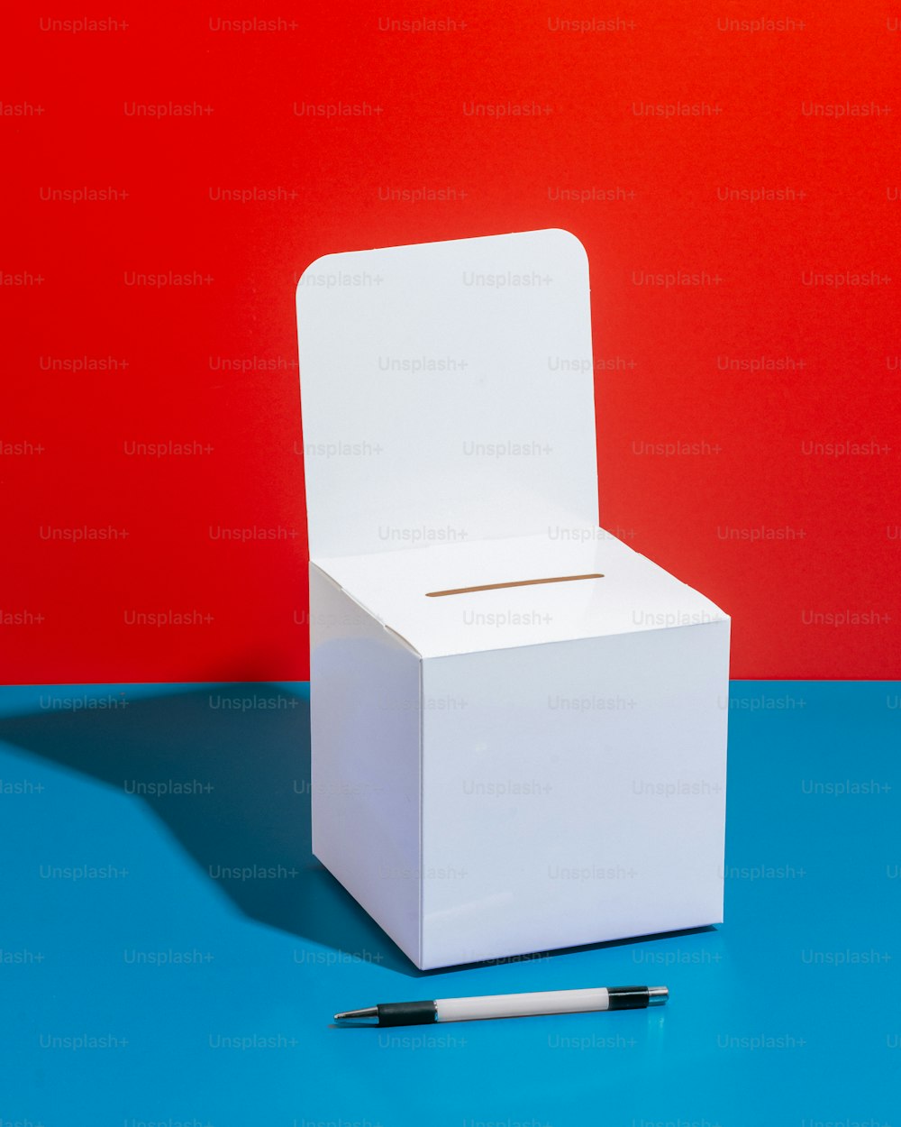 a white box sitting on top of a blue table