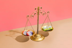 a scale with a bar of chocolate and a candy bar on it