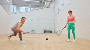 a couple of women playing a game of tennis