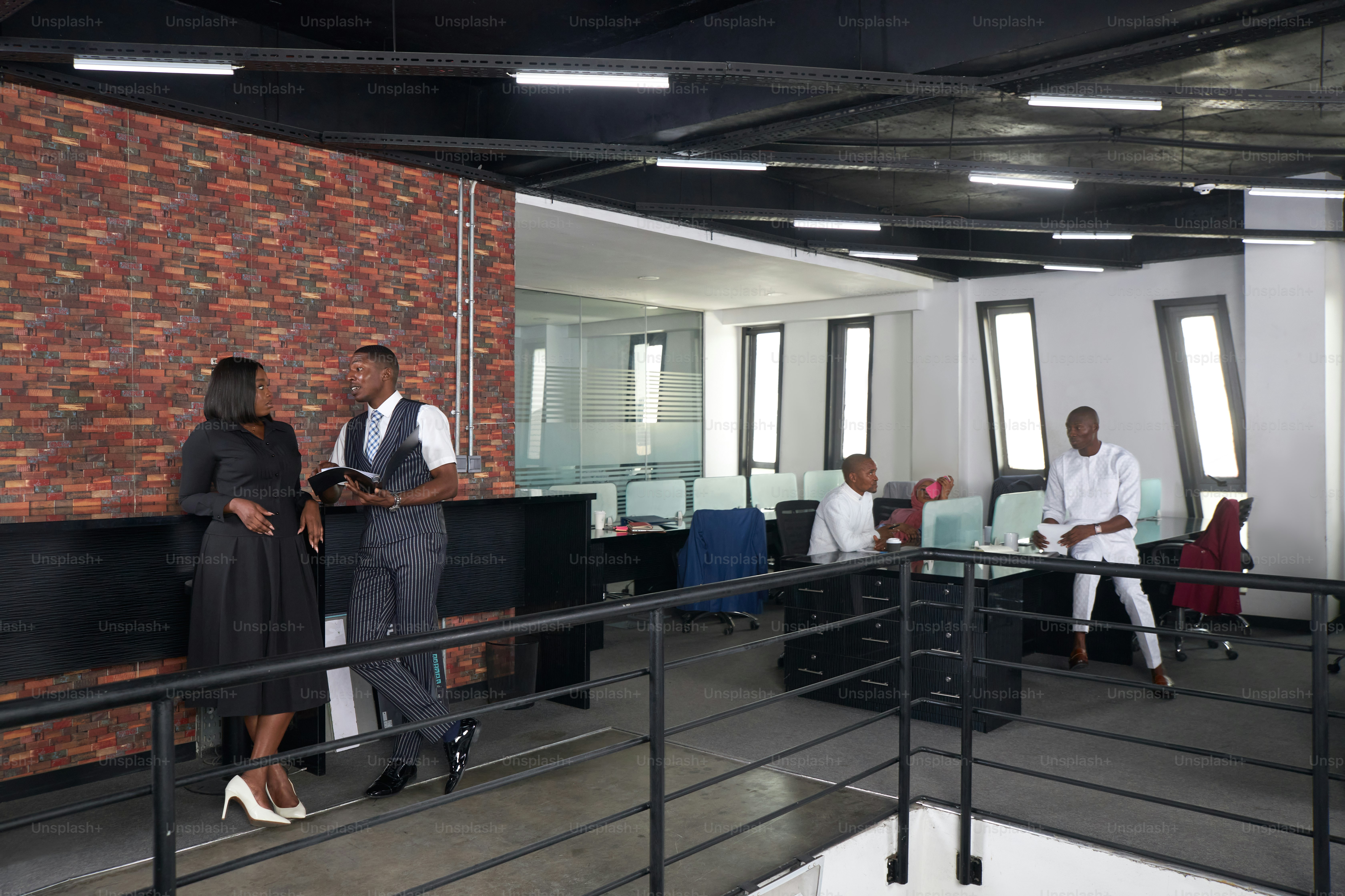 a group of people standing around a room