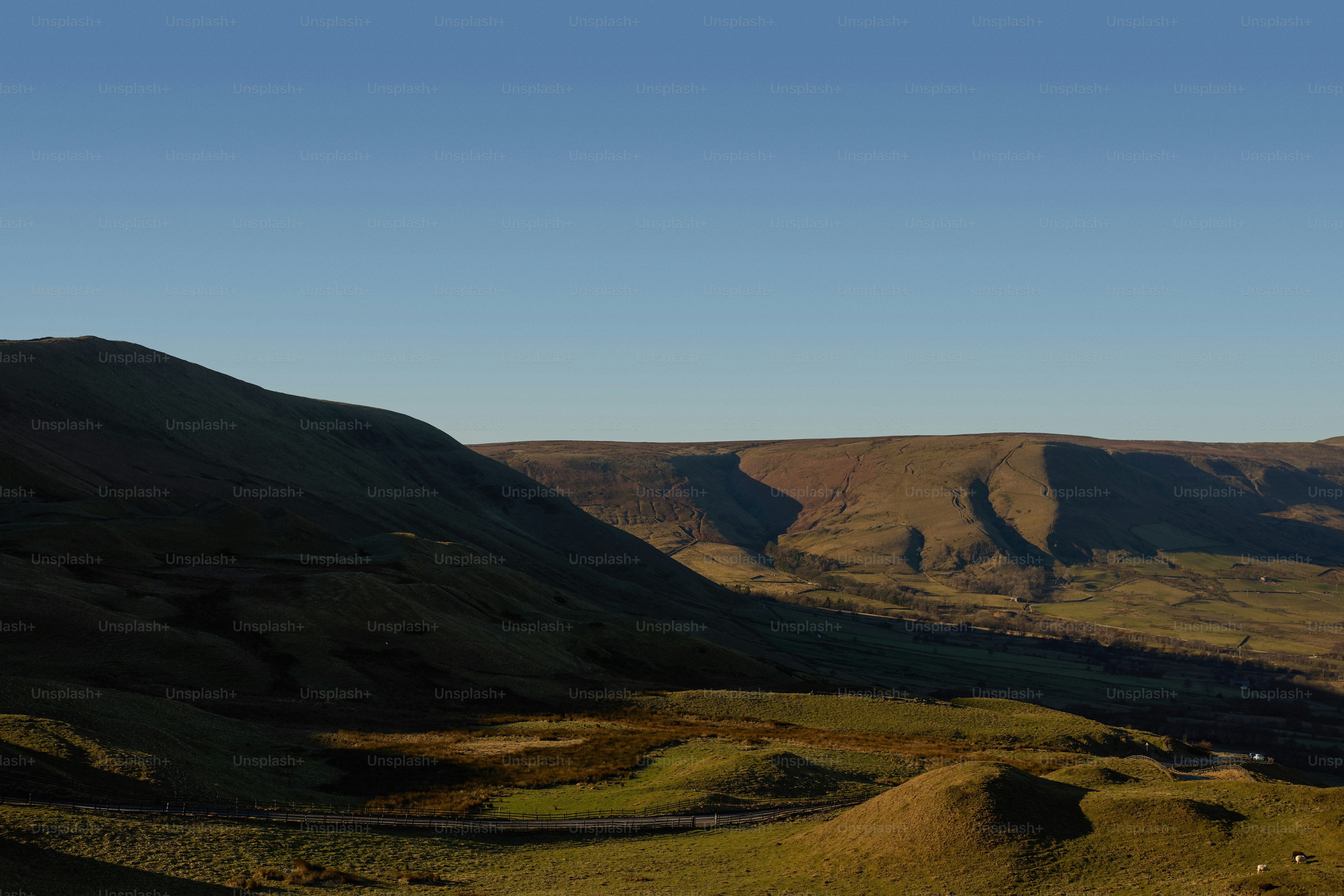 a view of a valley in the middle of a mountain range