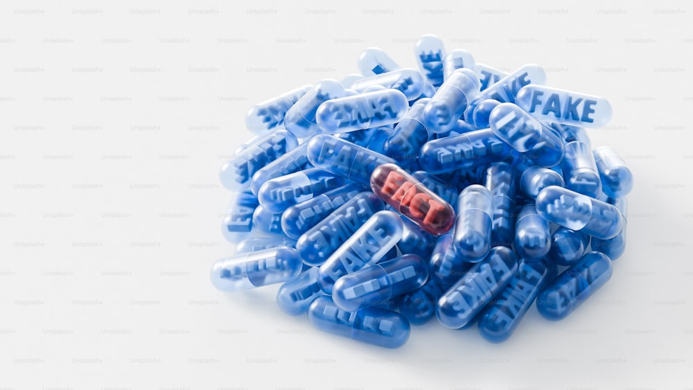 a pile of blue plastic letters sitting on top of a white table