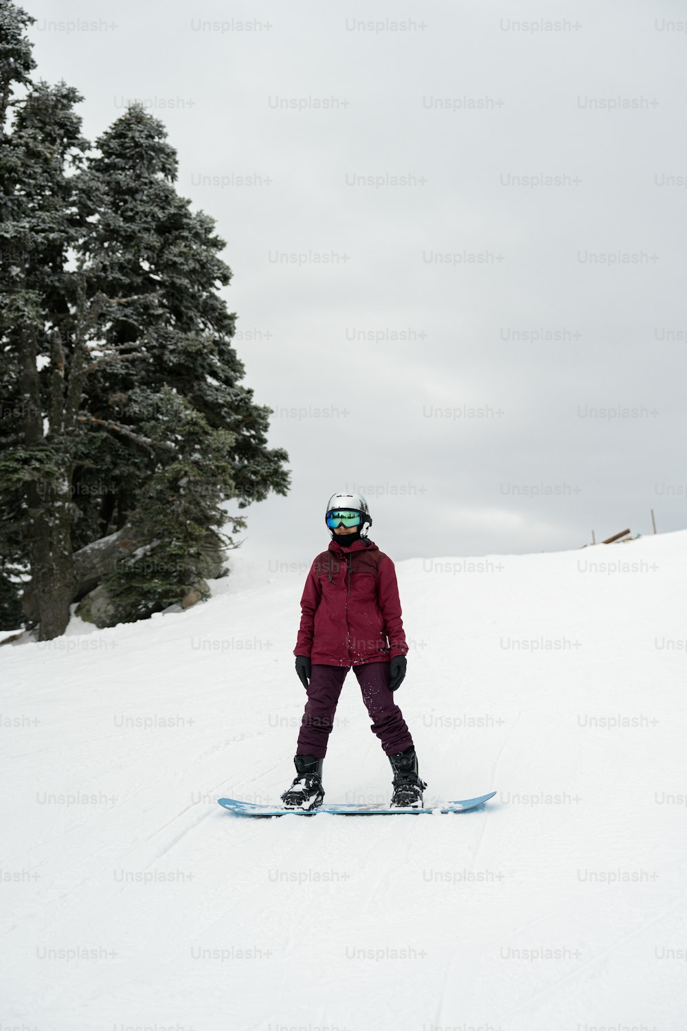 a person on a snowboard in the snow
