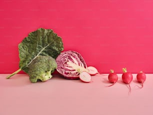 radishes, cabbage, and radishes on a pink surface