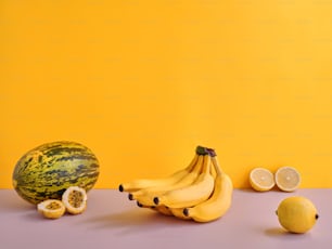 a bunch of bananas and some lemons on a table