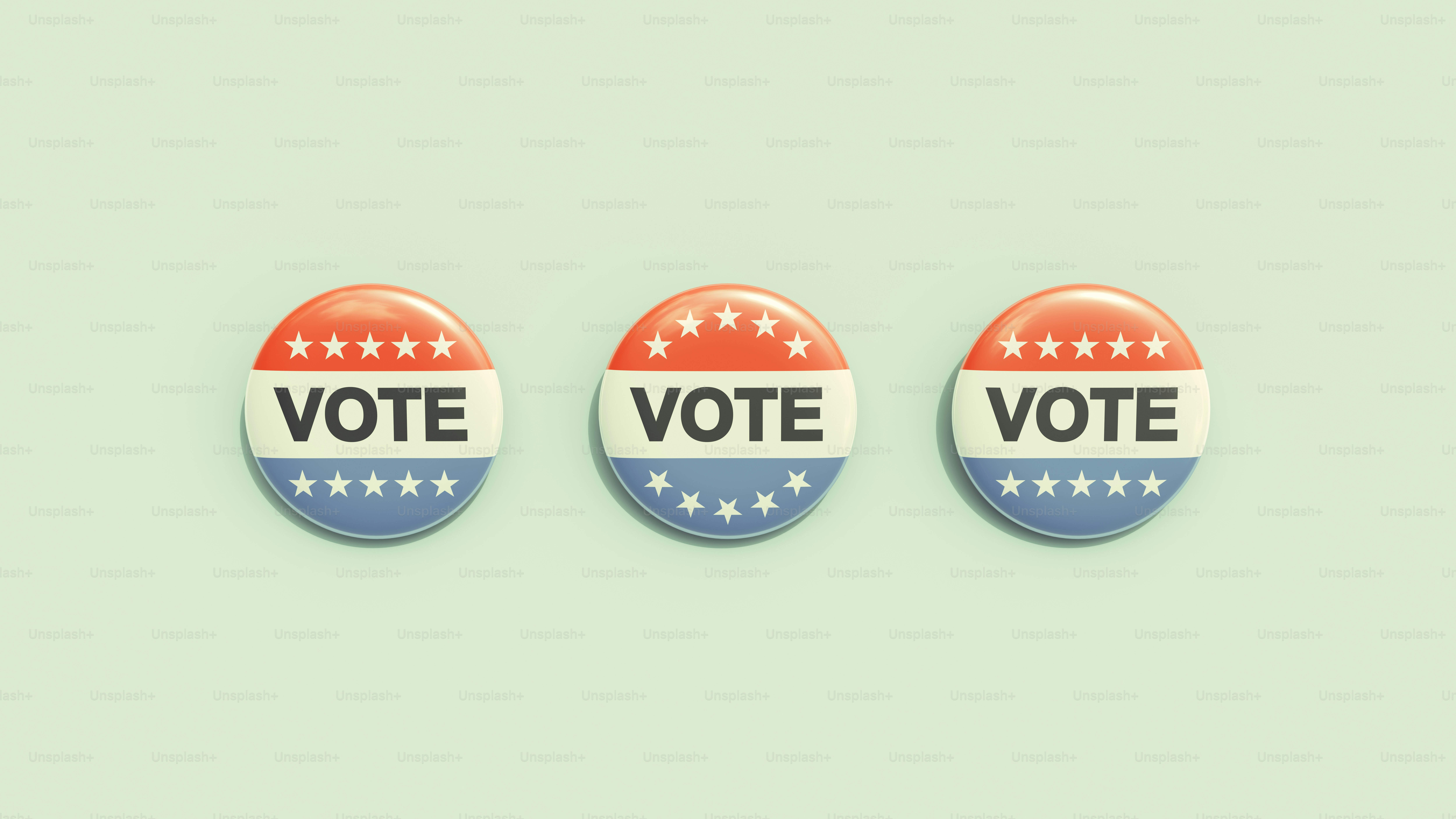 three buttons with the words vote on them