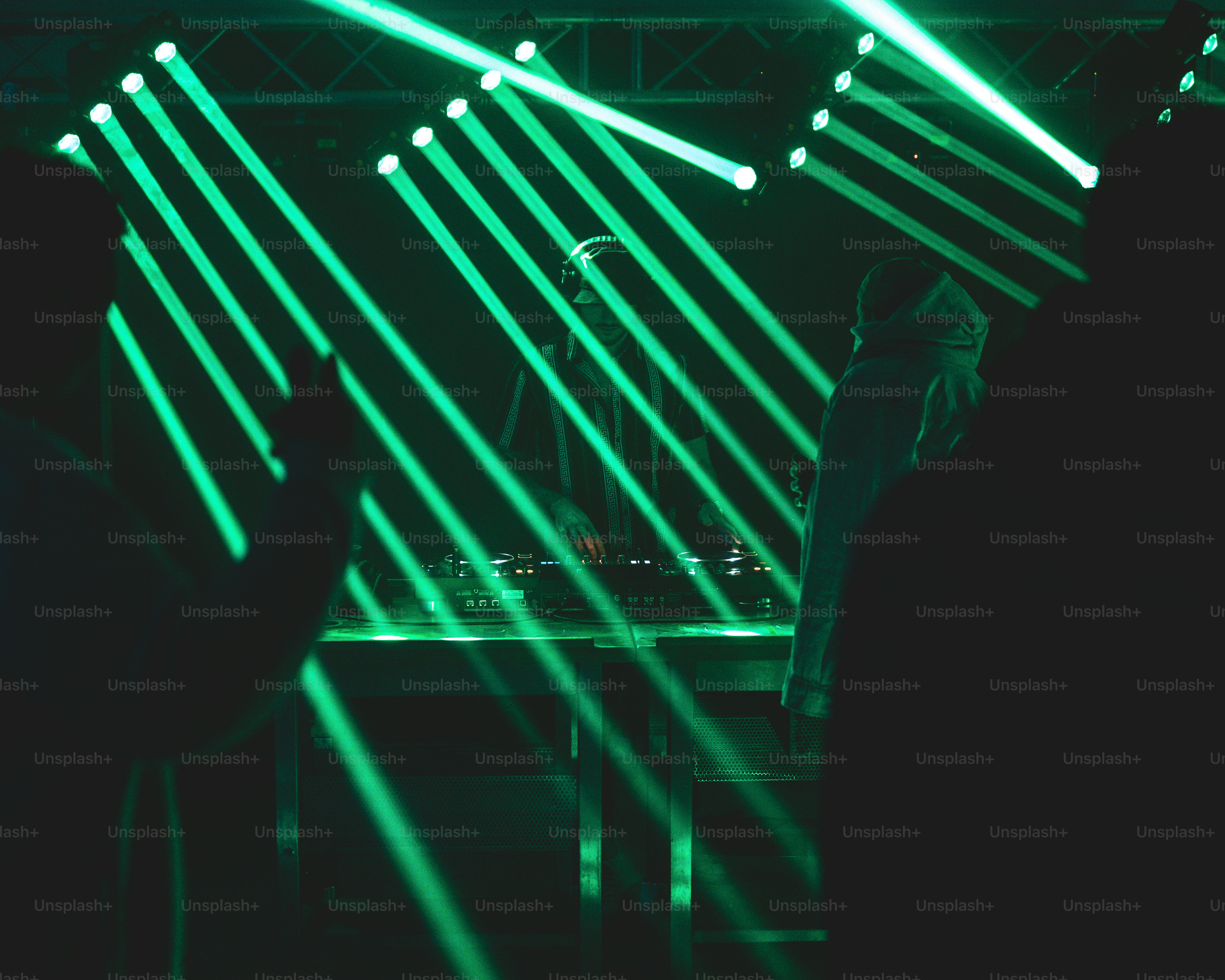 a group of people that are standing in the dark