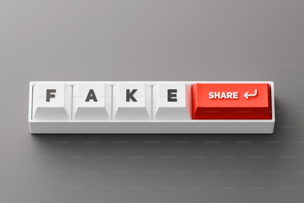 ein rot-weißer Knopf mit der Aufschrift "Fake"
