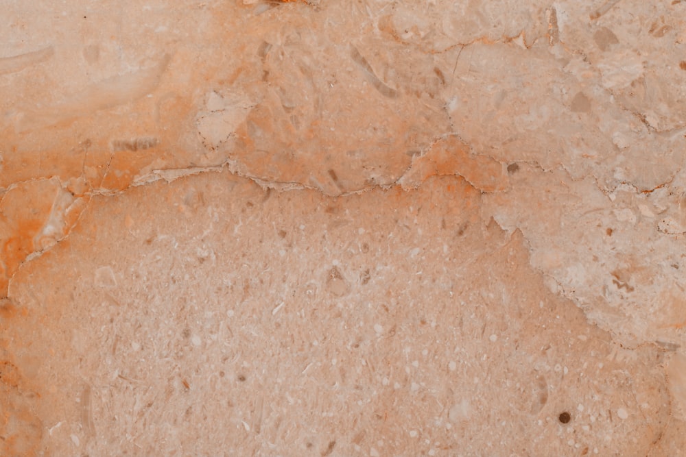 a close up of a brown marble surface