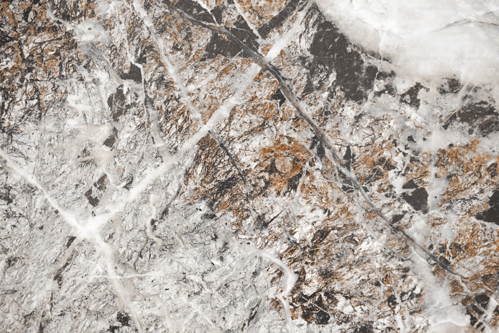 a close up of a marble surface with brown and white colors