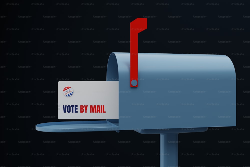 a blue mailbox with a vote by mail sticker on it