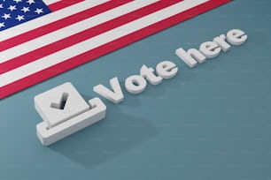 a vote here sign with an american flag in the background
