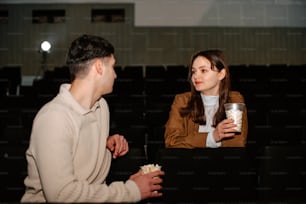a man and a woman sitting in a theater