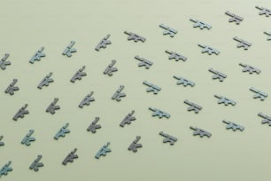 a large group of metal airplanes on a green surface