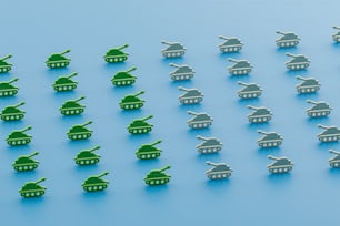a group of toy army tanks on a blue background