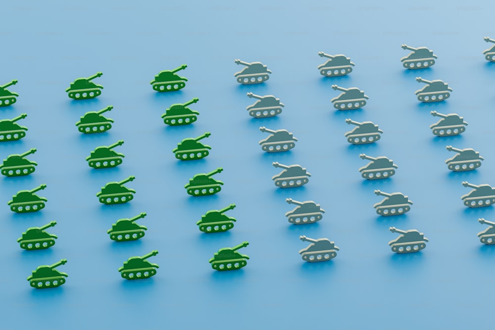 a group of toy army tanks on a blue background