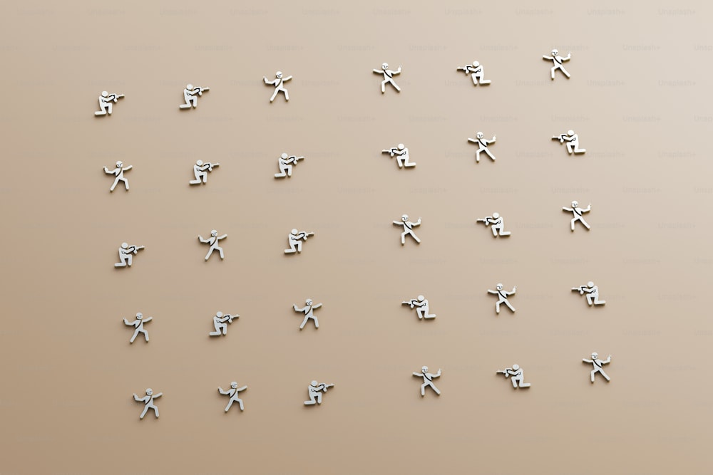 a group of silver crosses on a beige background