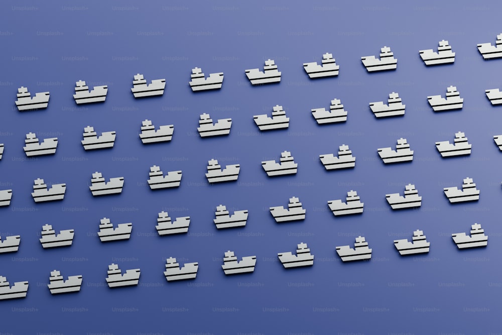 Um grande grupo de blocos de lego brancos sentados em cima de uma superfície azul
