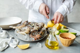 a person cutting up some food on a plate