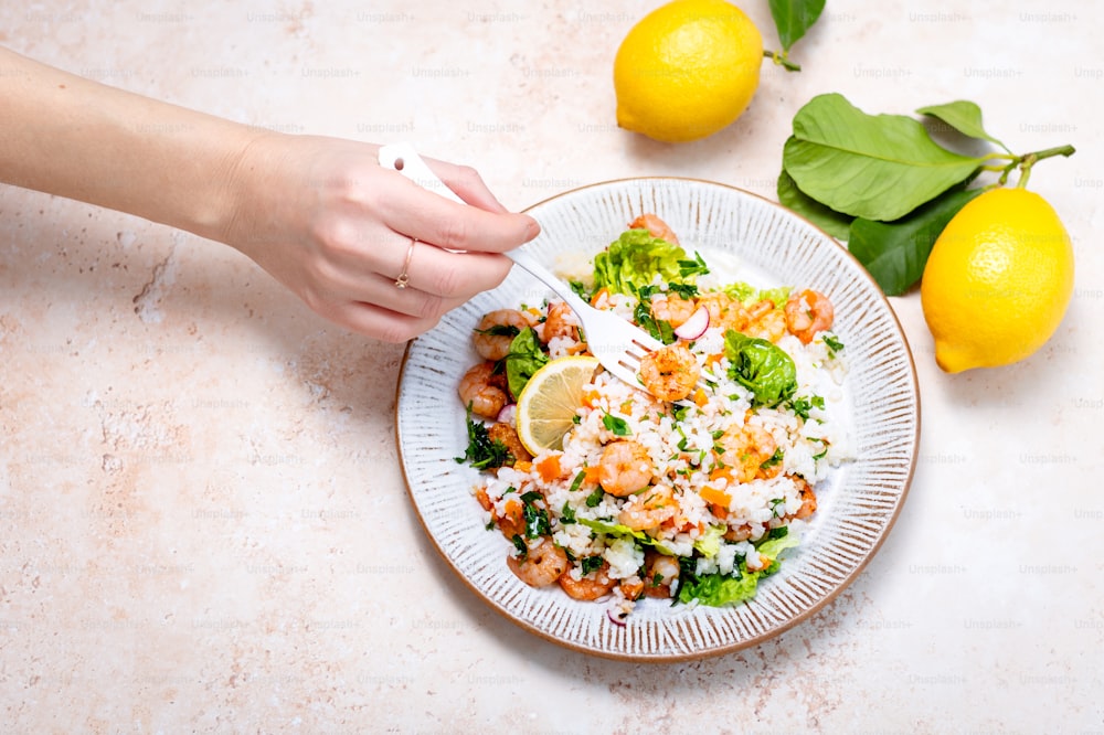 a plate of food on a table with lemons